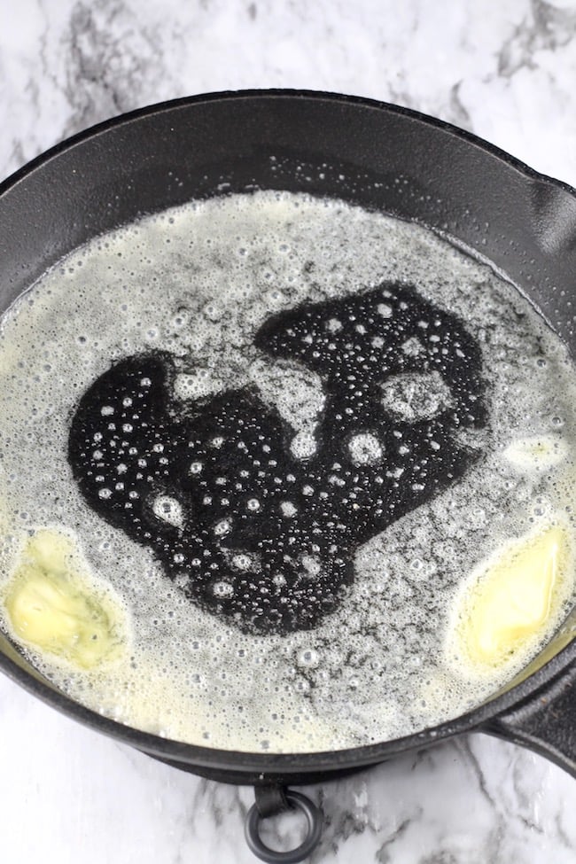 Melted butter in a cast iron skillet for cornbread