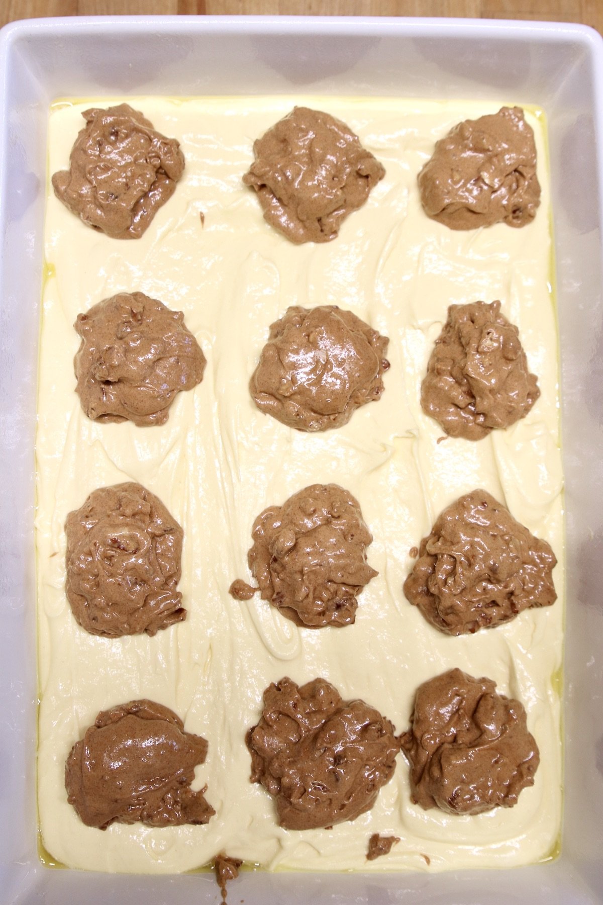 dollops of cinnamon streusel over cake batter