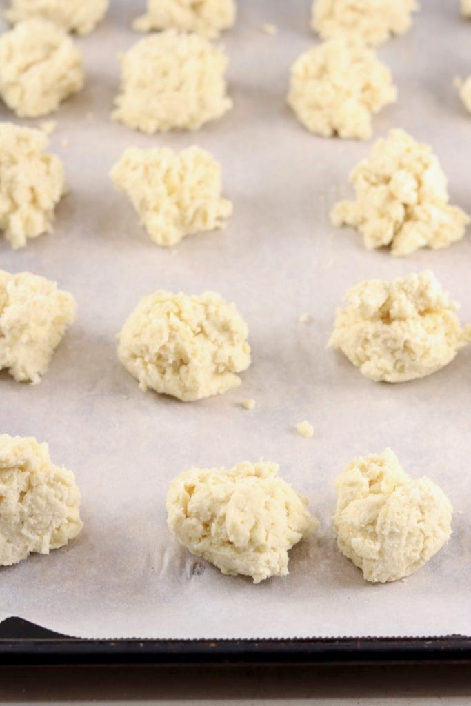 Drop biscuit dough on a parchment lined baking sheet
