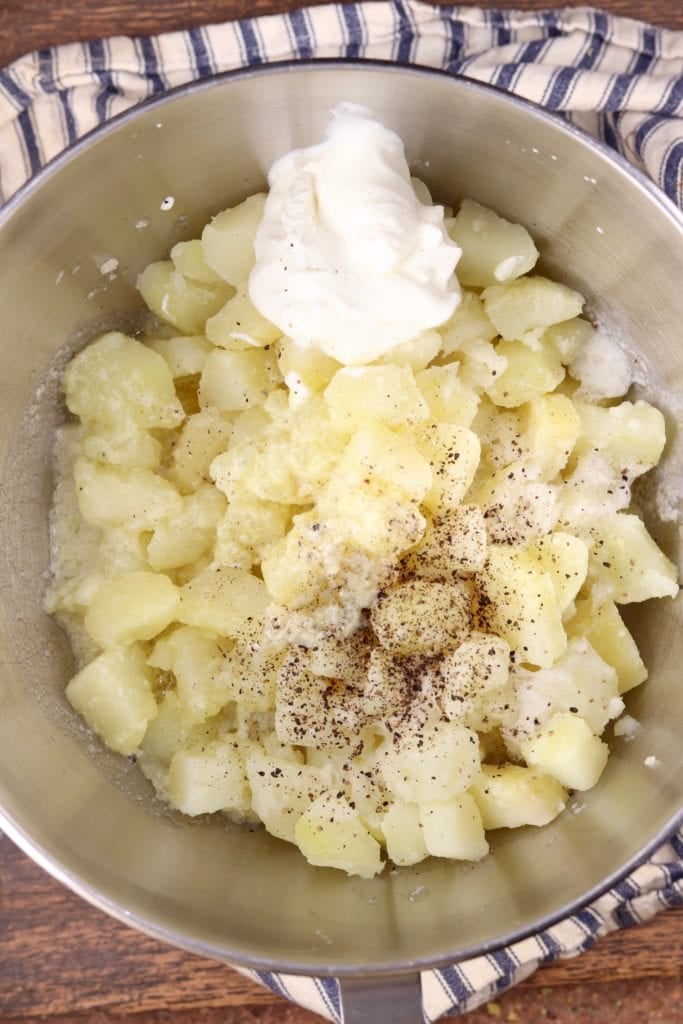Boiled potatoes with cream and sour cream ready to whip