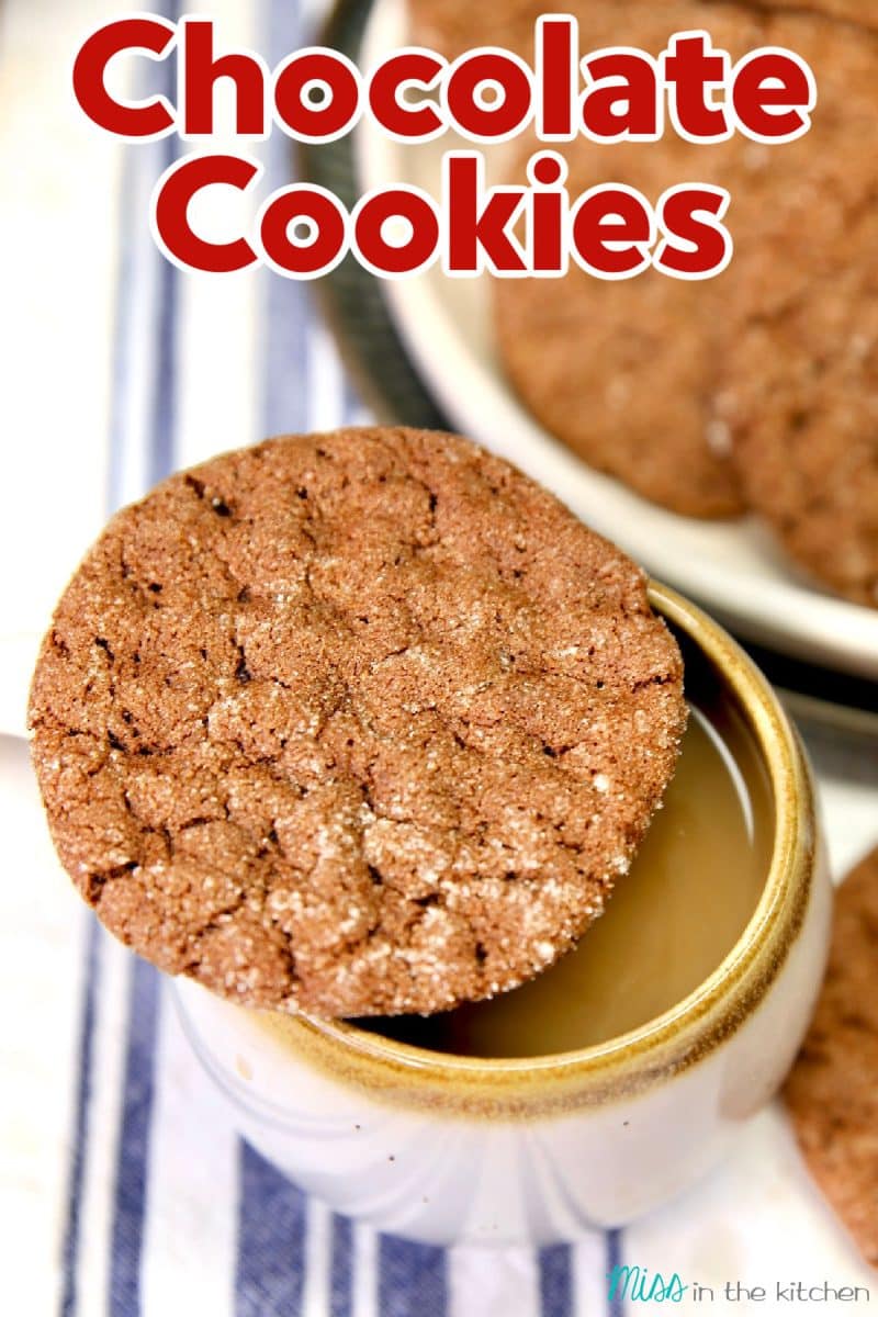 Chocolate cookie on a coffee cup - text overlay.