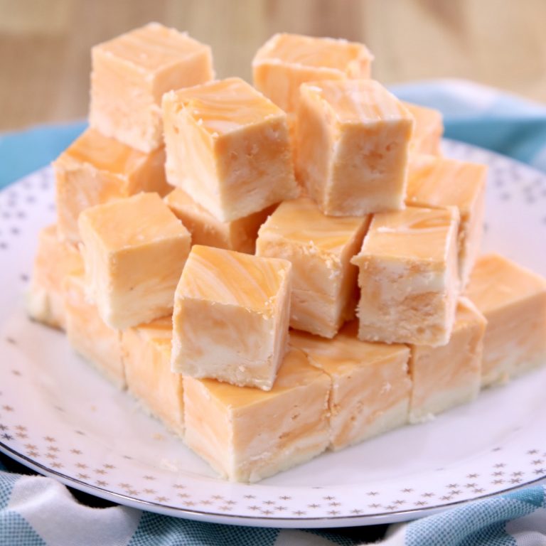 Creamsicle Fudge closeup of stack of slices on plate