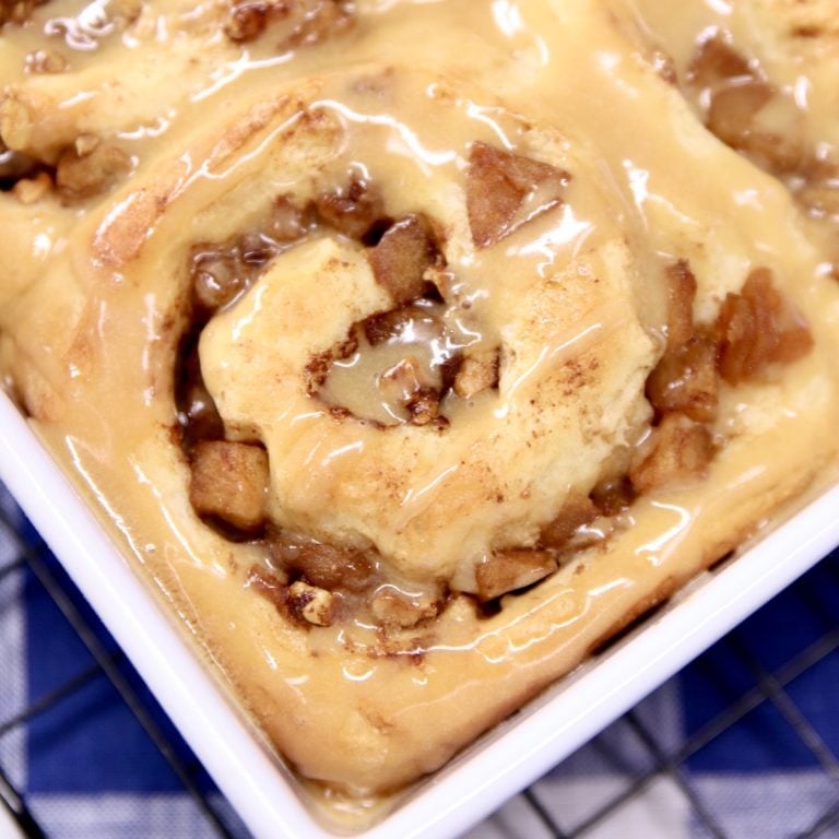 apple walnut cinnamon roll close up in pan