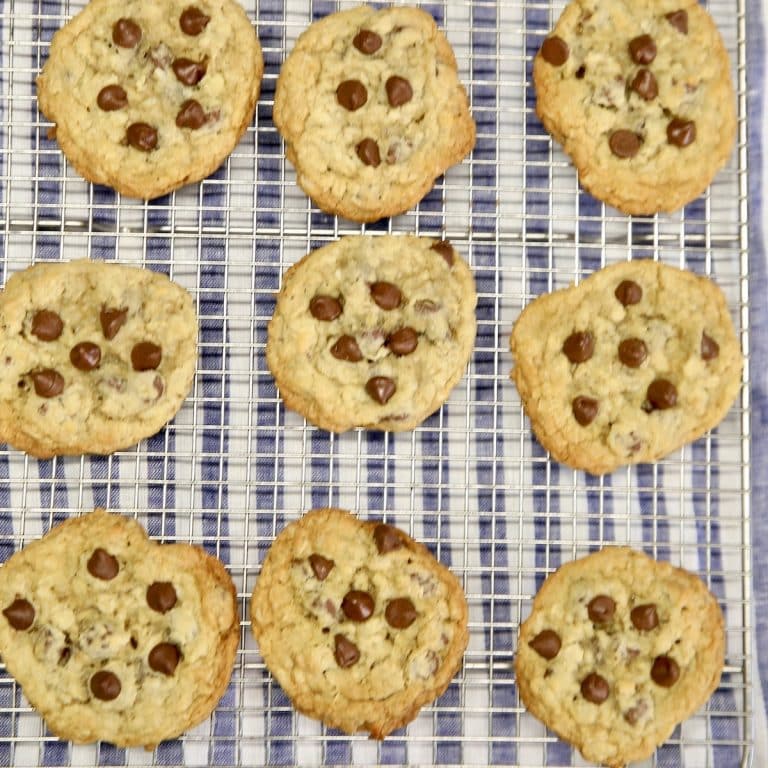 Chocolate chip cookies on a wire rack.