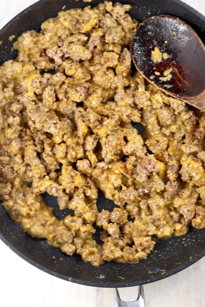 Browned Ground Beef with cheese in a skillet