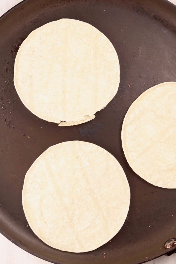 Heating tortillas on a skillet