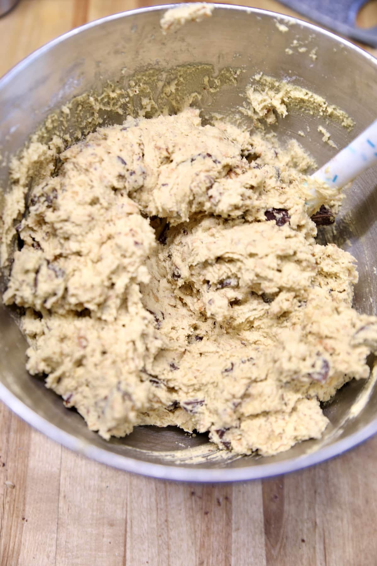 Chunky blondie cookie batter in a bowl.