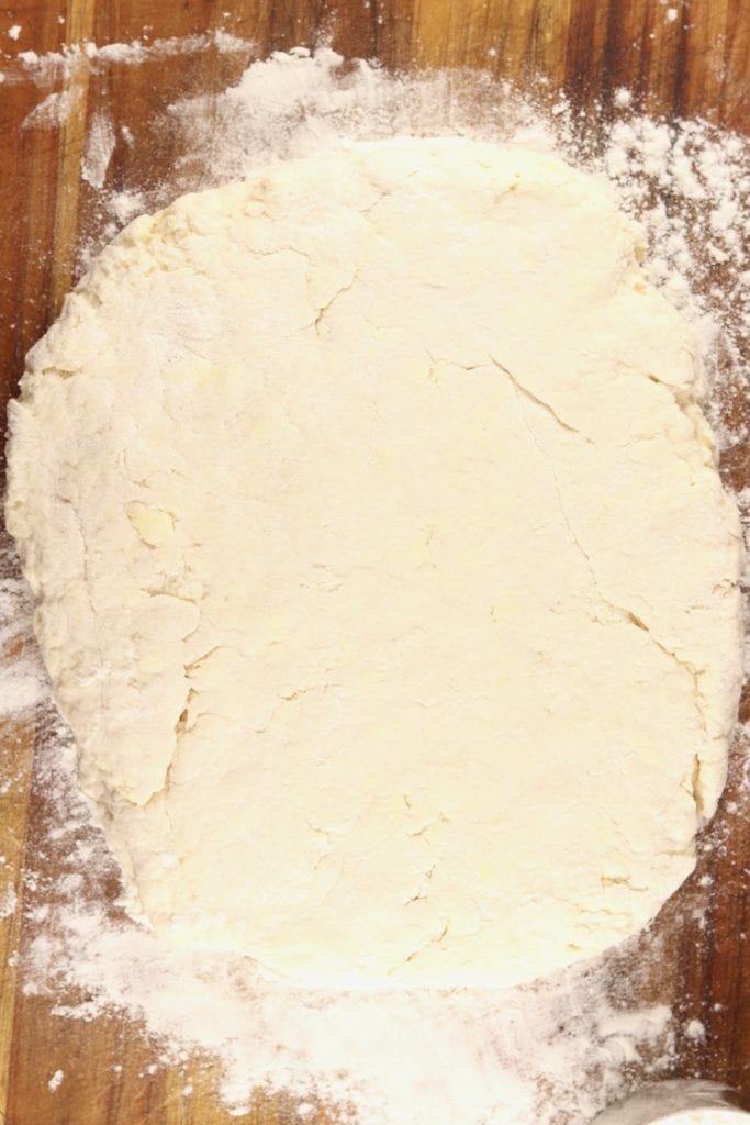 Biscuit dough on a floured cutting board 