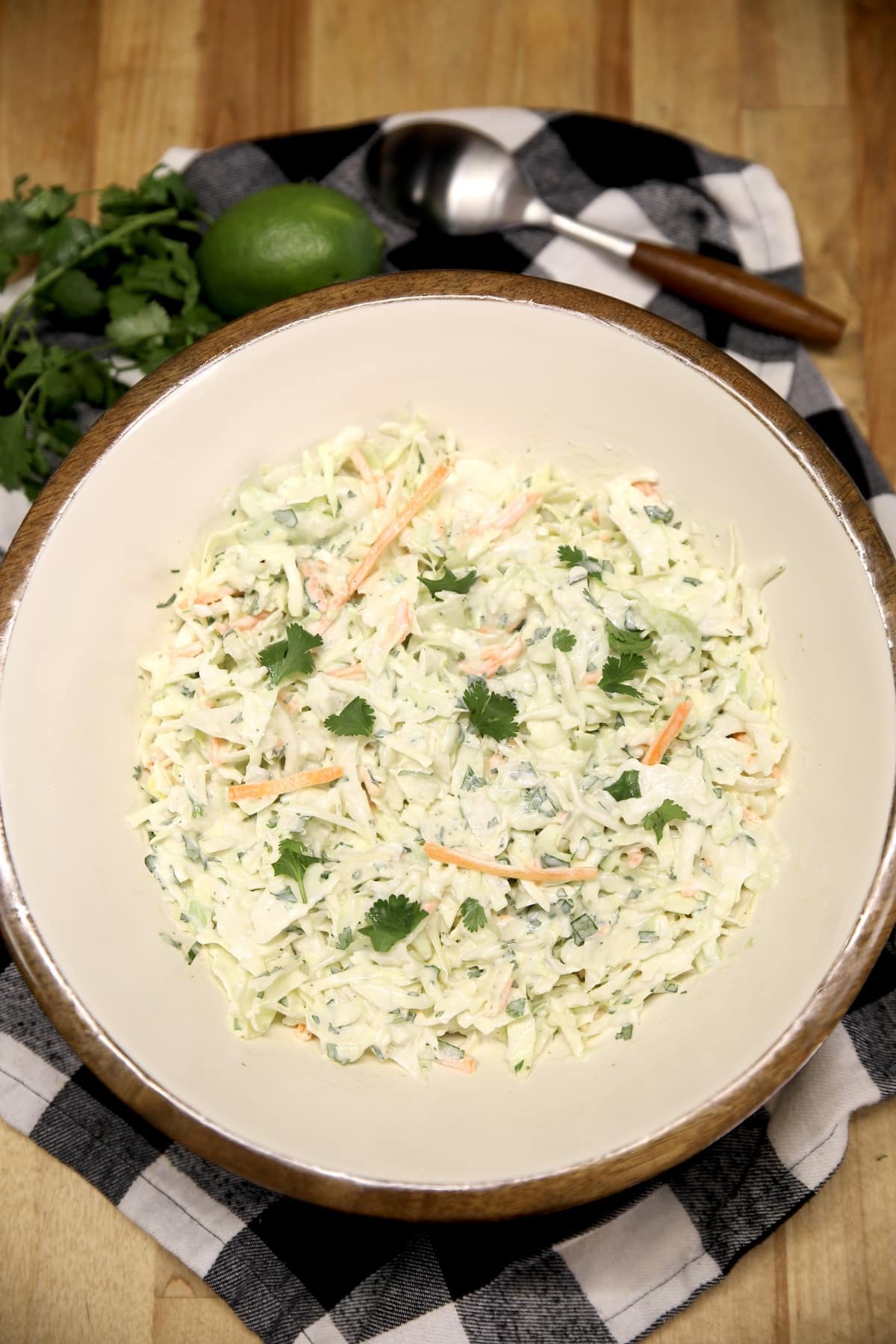 Bowl of cilantro lime coleslaw on a napkin. 