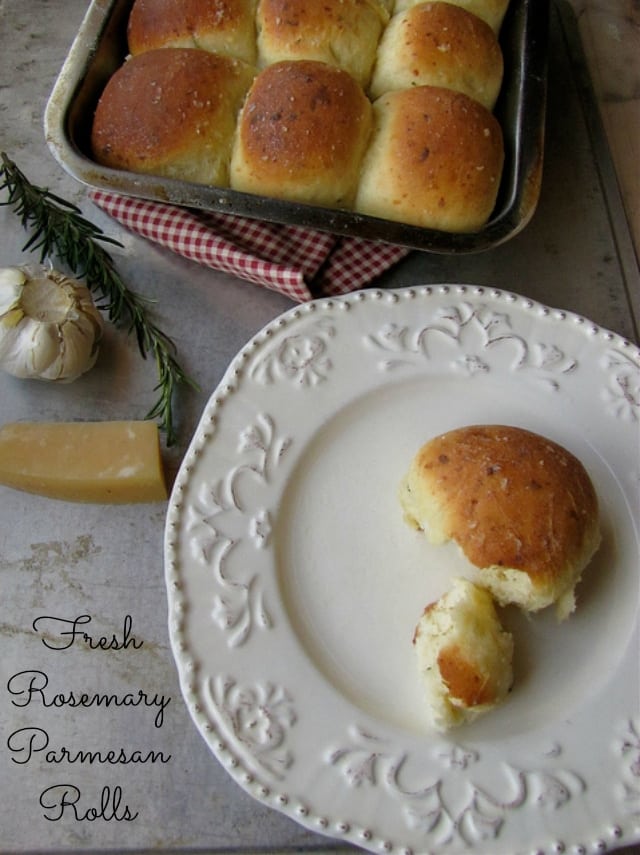 Rolls in a pan beside a plate with roll.