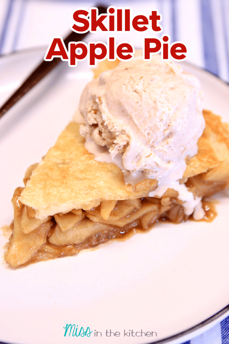 Close up of apple pie slice with ice cream on a plate. Text overlay.