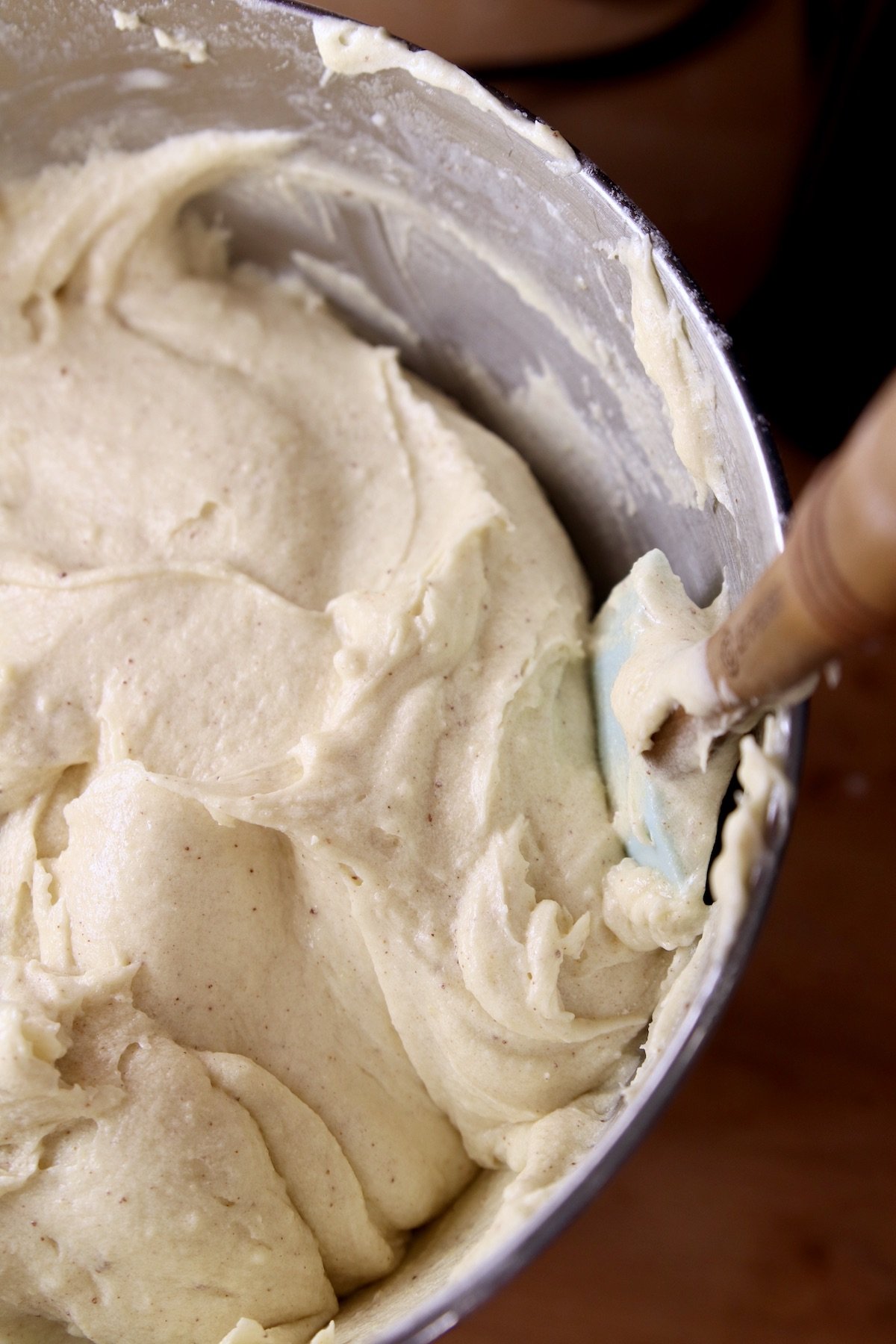 scraping bowl of cake batter