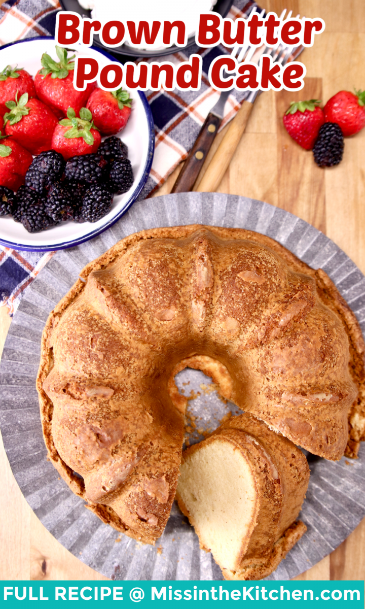 brown butter pound cake on cake plate, bowl of berries - text overlay