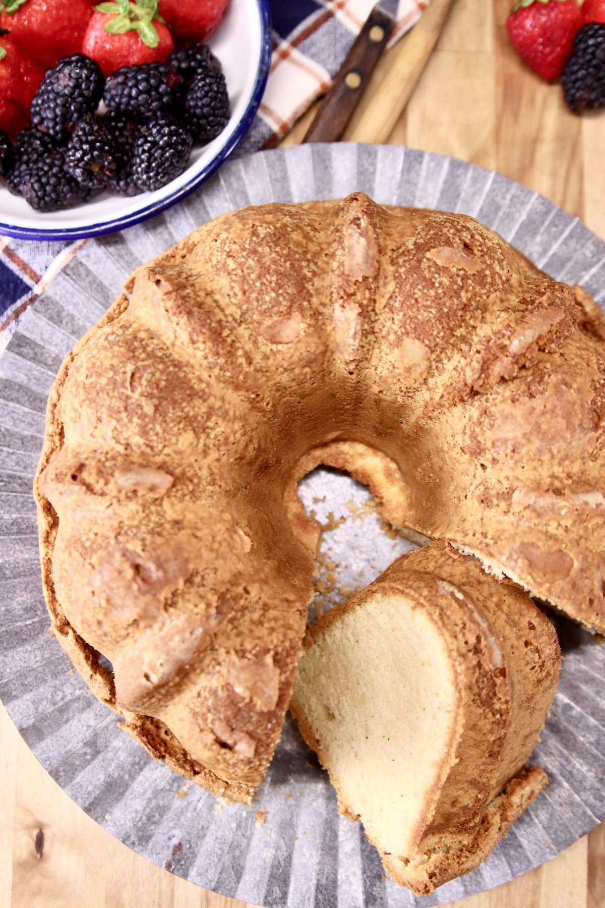 overhead of pound cake - bundt, one slice tilted