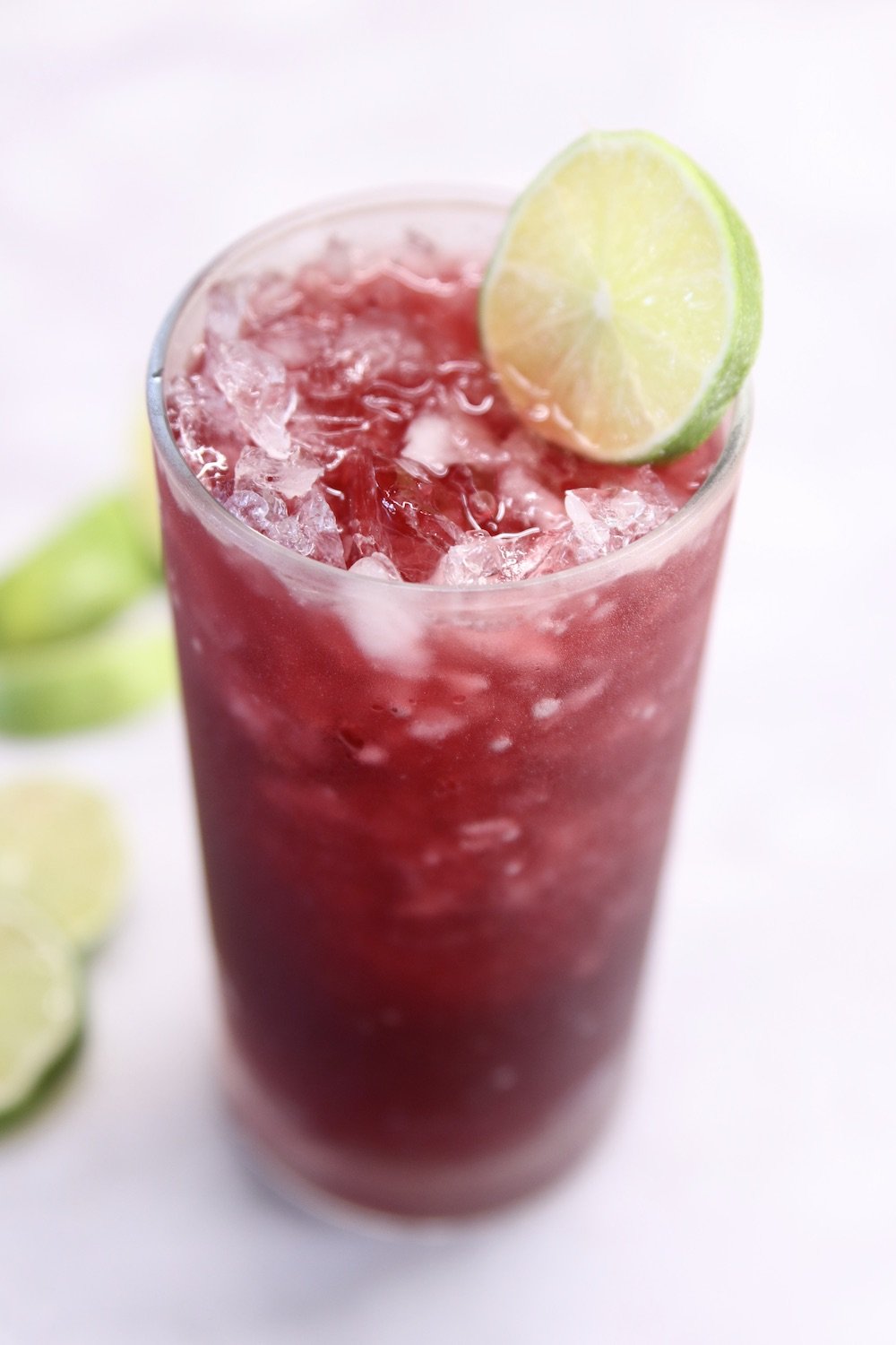 Pomegranate Margarita Cocktail with lime garnish