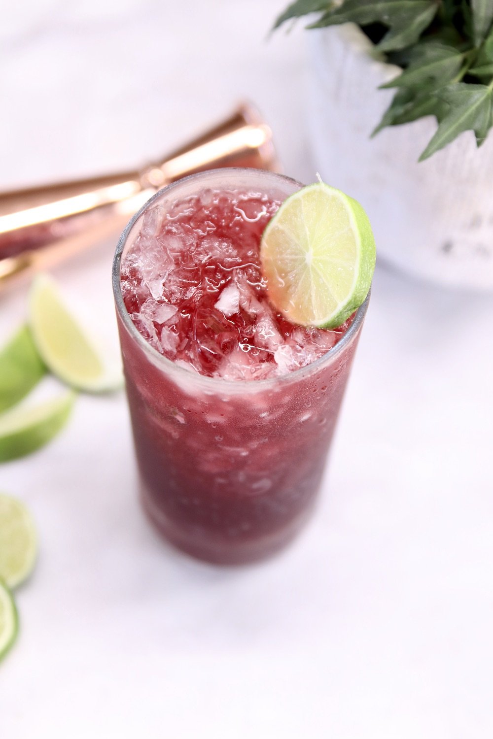 Pomegranate Margarita with lime wheel garnish