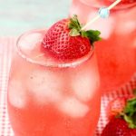 Stemless Wine Glass of Strawberry Wine Punch garnished with a fresh strawberry