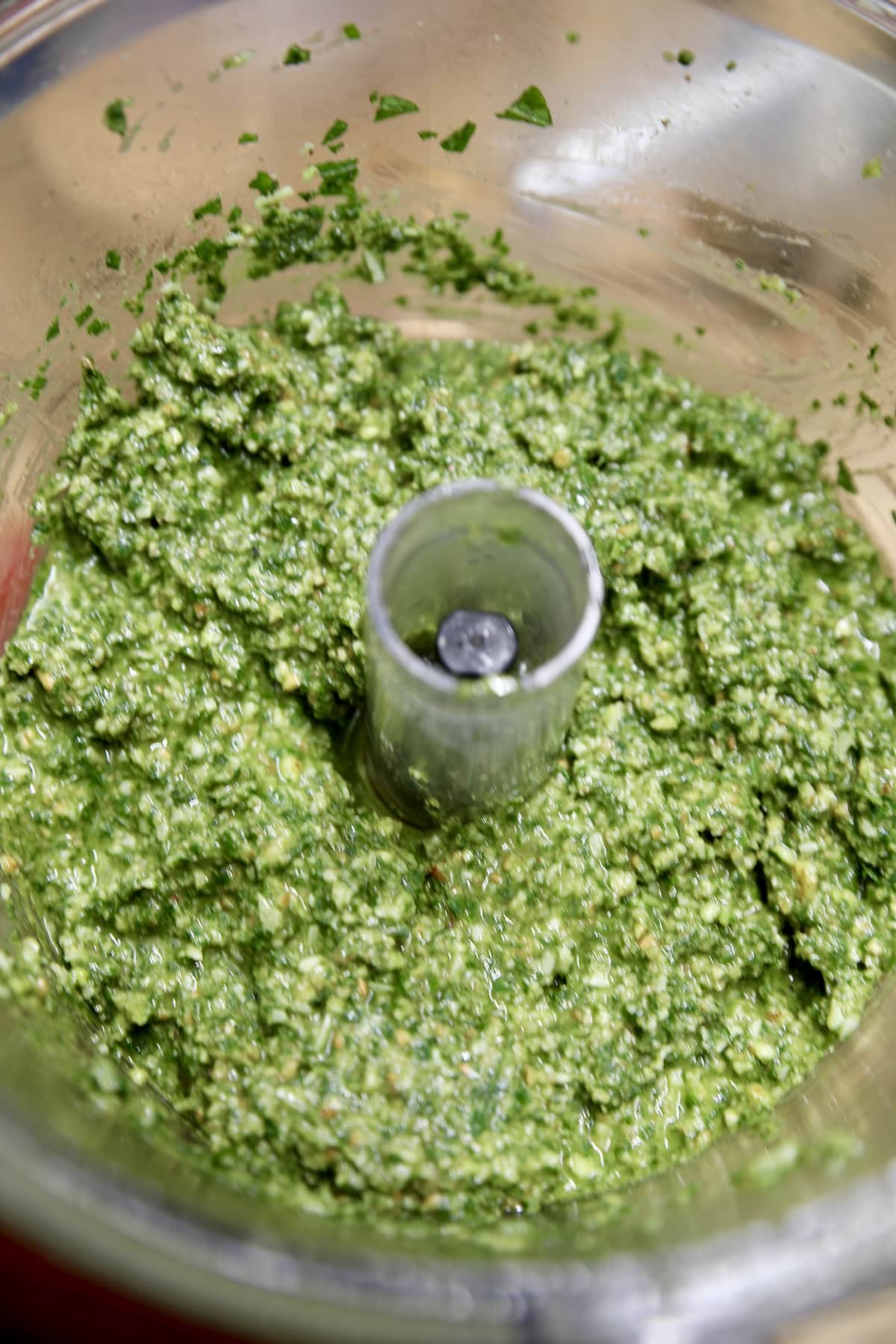 Food processor with basil pesto. 