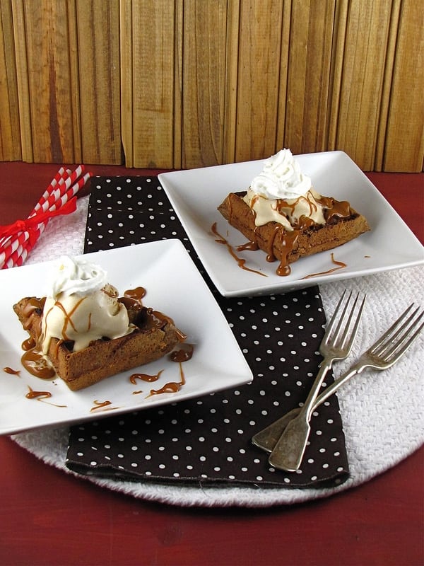 Chocolate waffles with ice cream and caramel sauce.