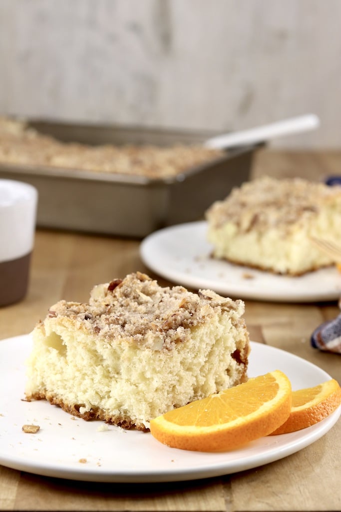 Coffee cake on 2 plates, cake pan in background