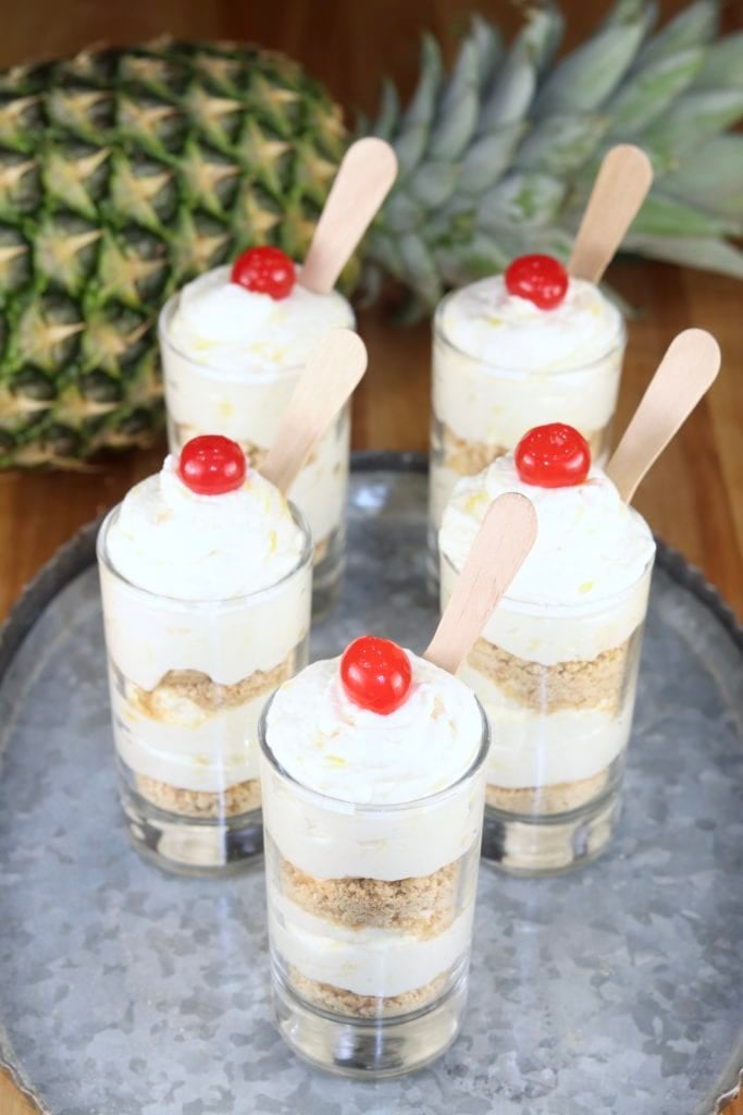 Pineapple No Bake Cheesecake with cherry garnish