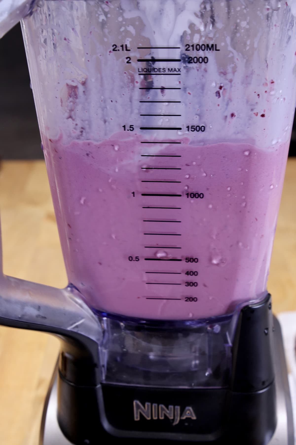Blending blackberry milkshakes.