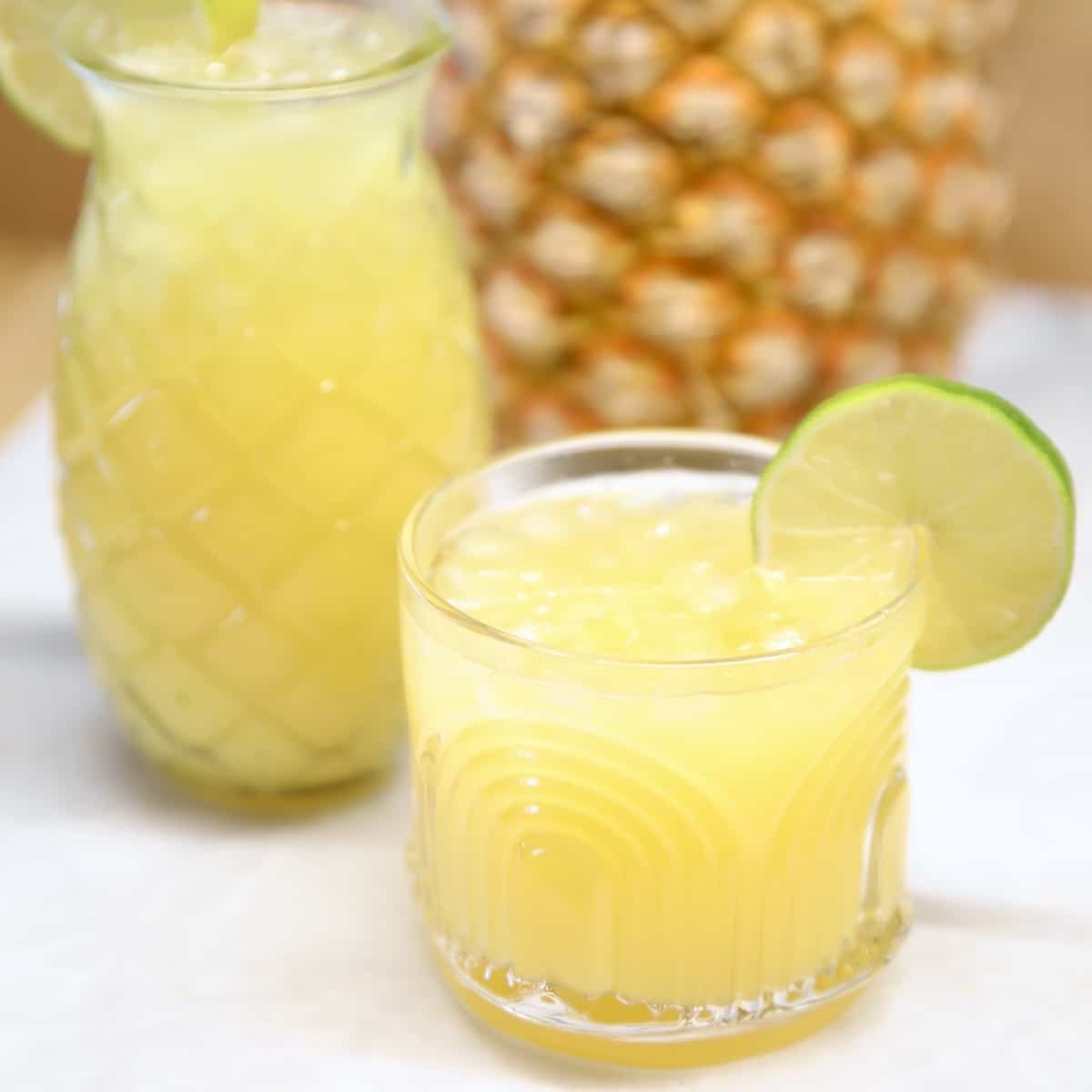 Pineapple margaritas in an old fashioned glass, tiki glass.