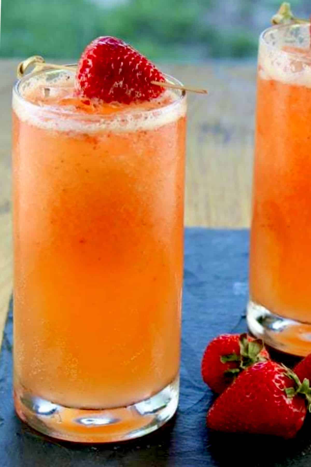 Strawberry mango coolers party punch. Glass with strawberry mango coolers.