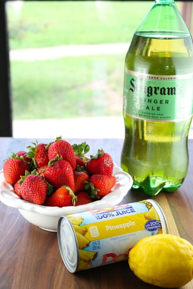 Summer Berry Punch with strawberries, lemon pineapple and ginger ale