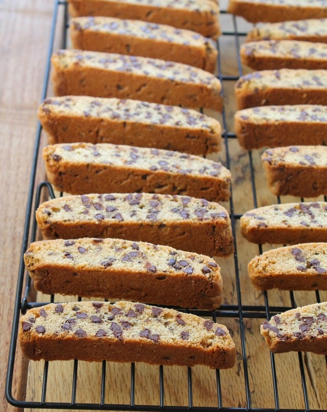 Chocolate chip biscotti on a wire rack.