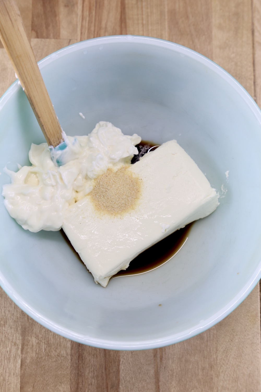 cream cheese, mayo, sour cream, garlic in a bowl for making dip