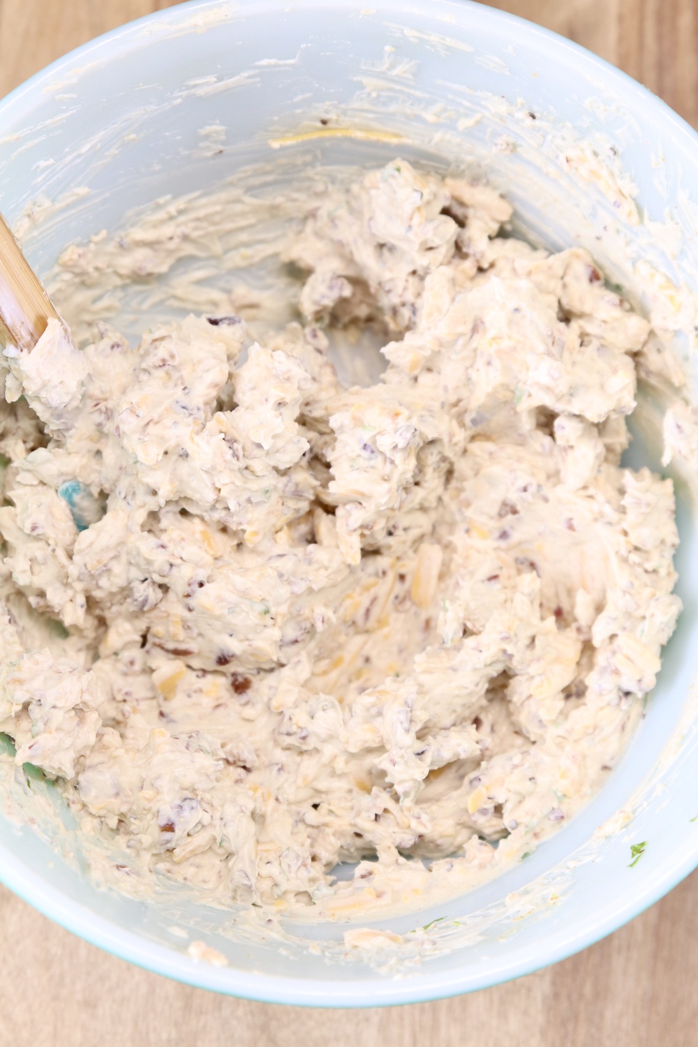 Party dip in a bowl with cheese and bacon