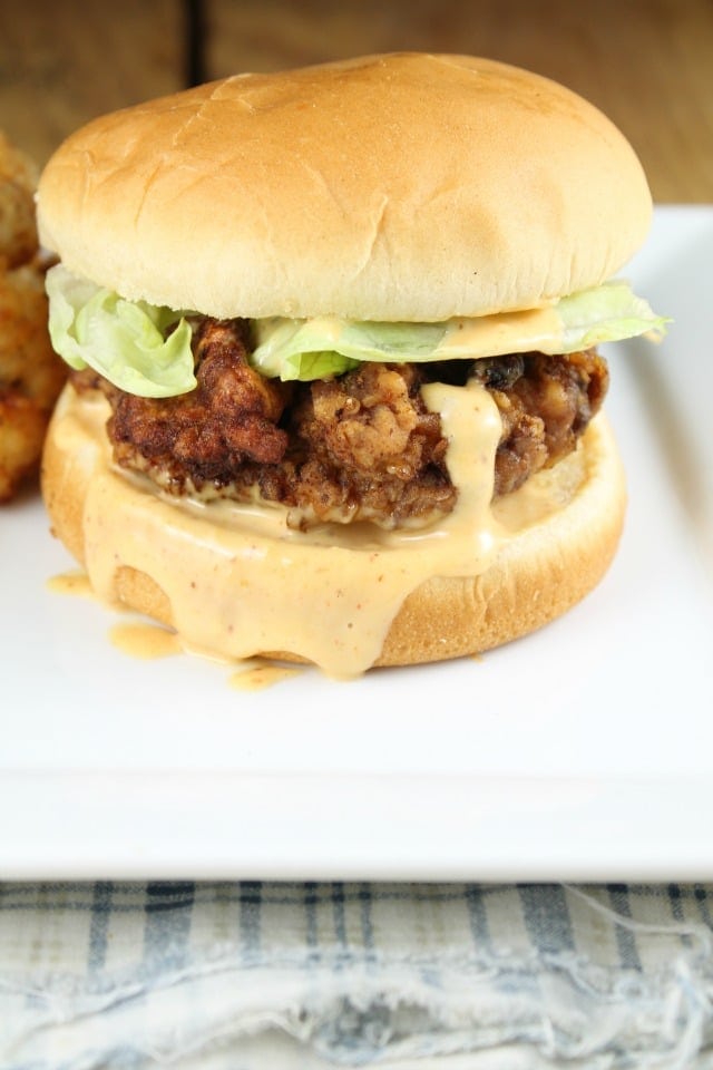 Chicken fried steak sandwich with spicy mayo. Chicken Fried Steak Sandwich Recipe found at MissintheKitchen.com