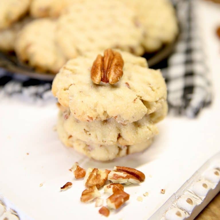 Stack of pecan sandies cookies.