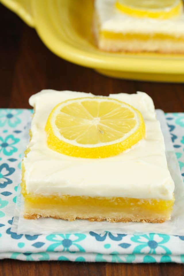 Lemon Bars with Cream Cheese Icing is a delicious dessert recipe for any party or family get together. From MissintheKitchen.com
