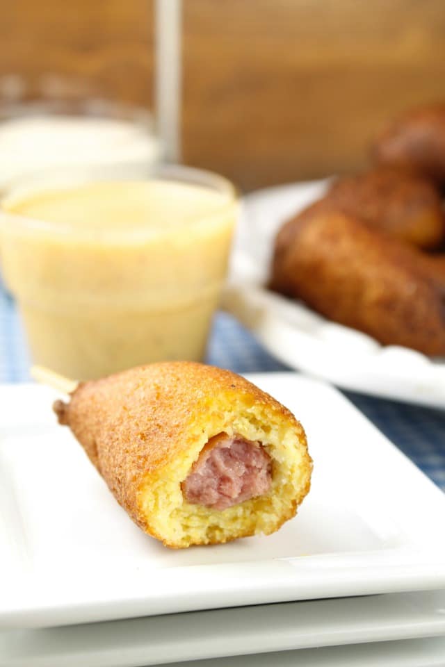 Homemade Mini Corn Dogs are a tasty bite- sized snack for family get togethers and game day parties. Made with a homemade cornbread batter and mini smoked sausages. Also try them for lunch or as an after school snack! Find the Recipe at Miss in the Kitchen