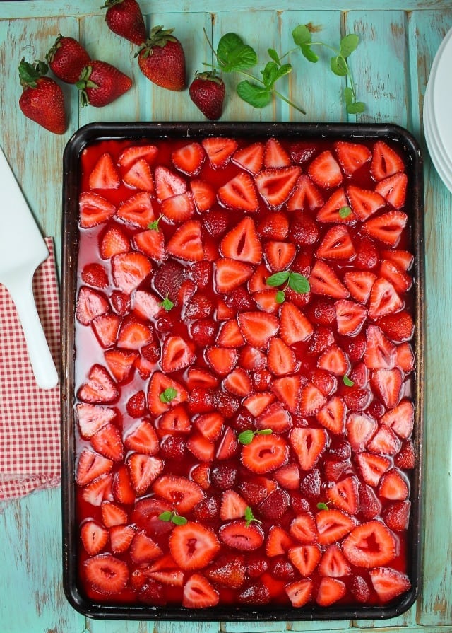 Strawberry Slab Pie Recipe made with fresh summer strawberries for the perfect summer dessert. From MissintheKitchen.com 