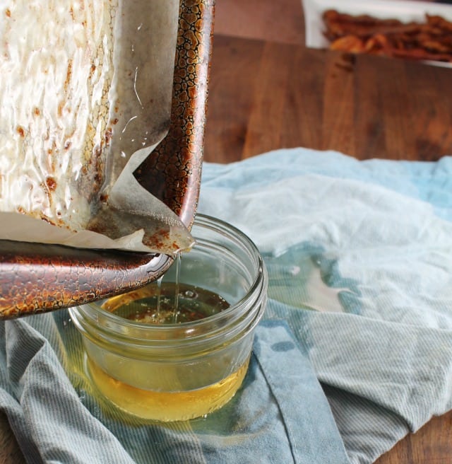 Pouring bacon drippings from a pan into a jar