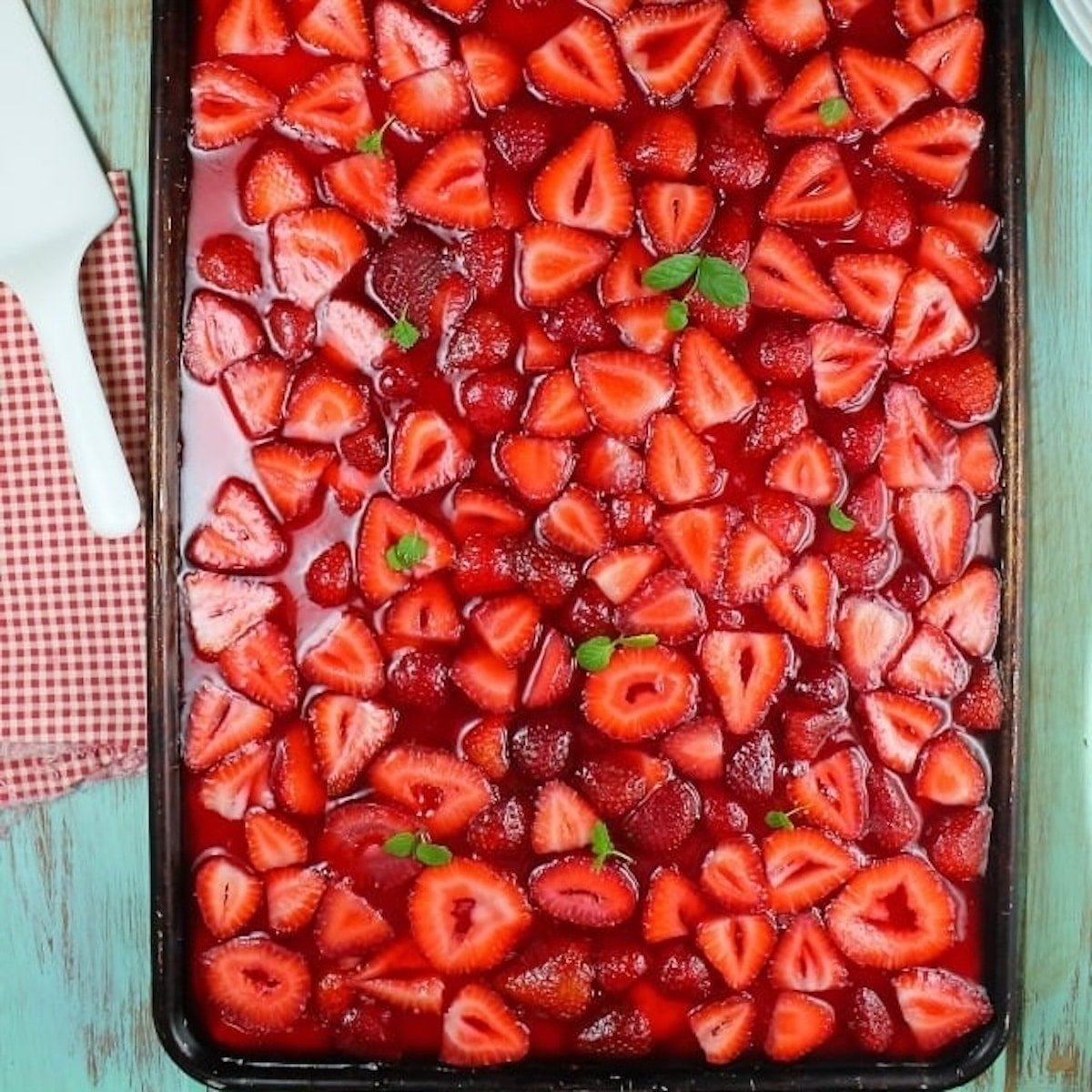 Strawberry slab pie in a sheet pan.