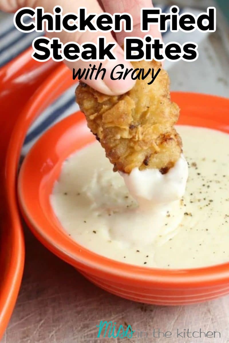 Chicken fried steak bite dipping in gravy - text overlay.