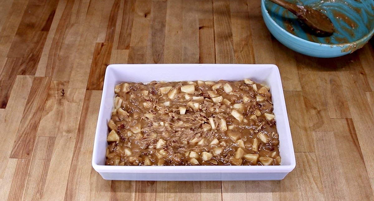 9 x 13 baking dish with apple cake ready to bake