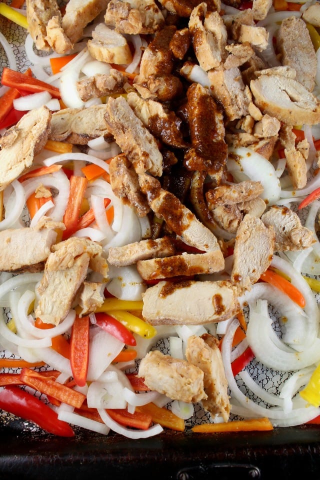 Sheet Pan Chicken Fajitas ready for the oven. MissintheKitchen.com