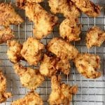 Popcorn chicken on a wire rack.