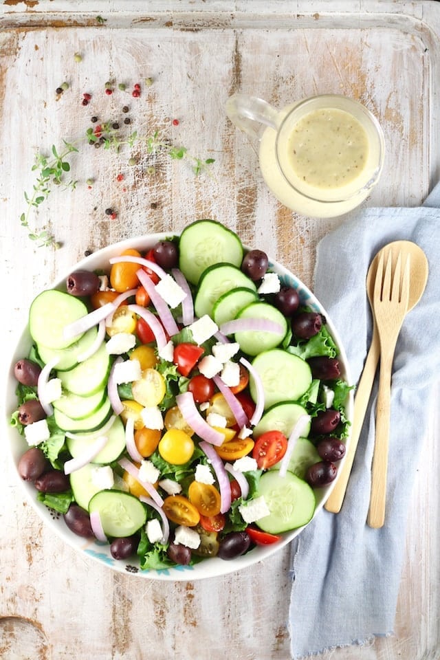 Greek Salad with Roasted Garlic Salad Dressing Recipe ~ A flavor packed salad that works as a side dish or main dish salad for any night of the week. From MissintheKitchen.com