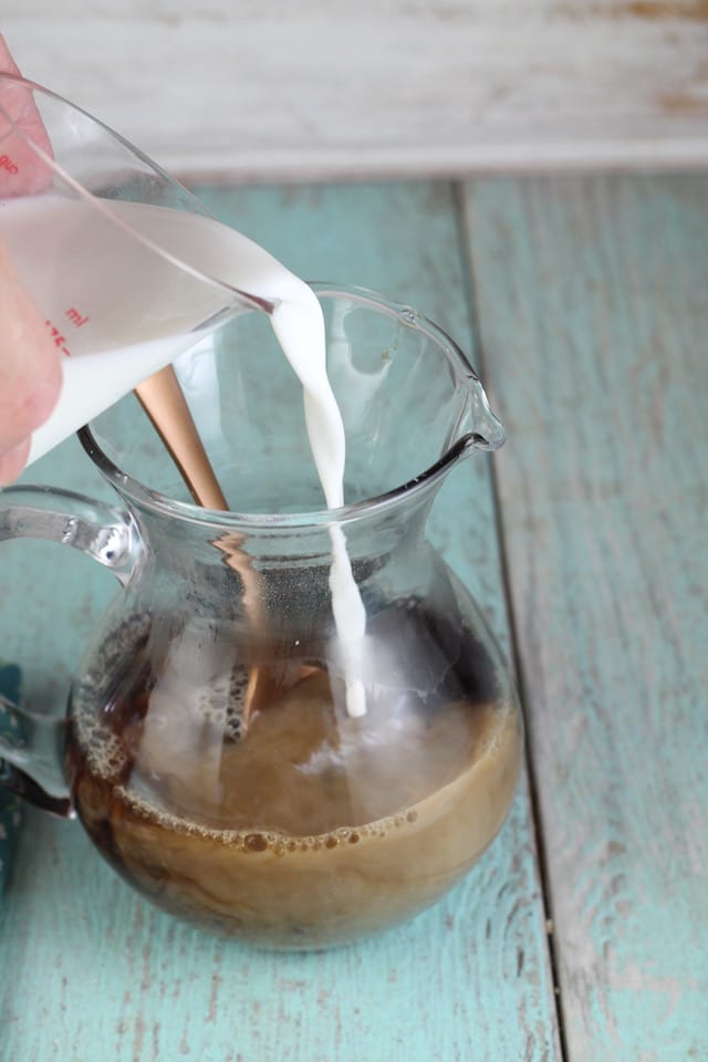 Mocha Popsicles ~ adding milk ~ MissintheKitchen.com #sponsored by Nielsen- Massey Vanillas