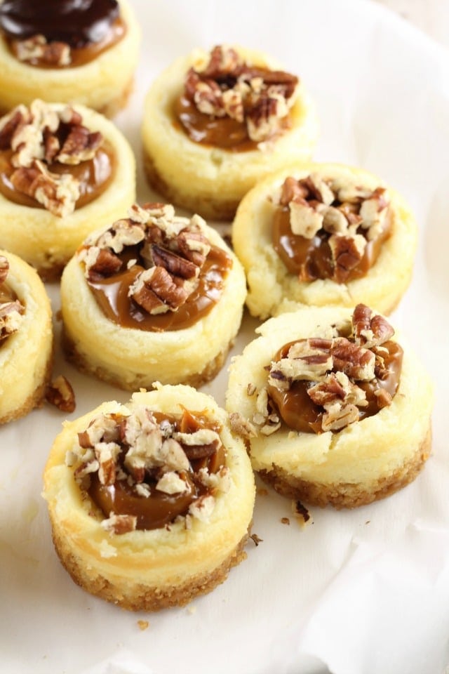 Adding the toppings to Mini Turtle Cheesecakes ~ MissintheKitchen.com