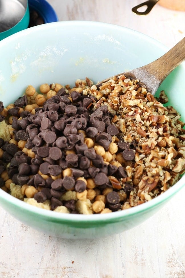 caramel bits, chocolate chips and pecans added to the bowl for salted caramel cookie bars