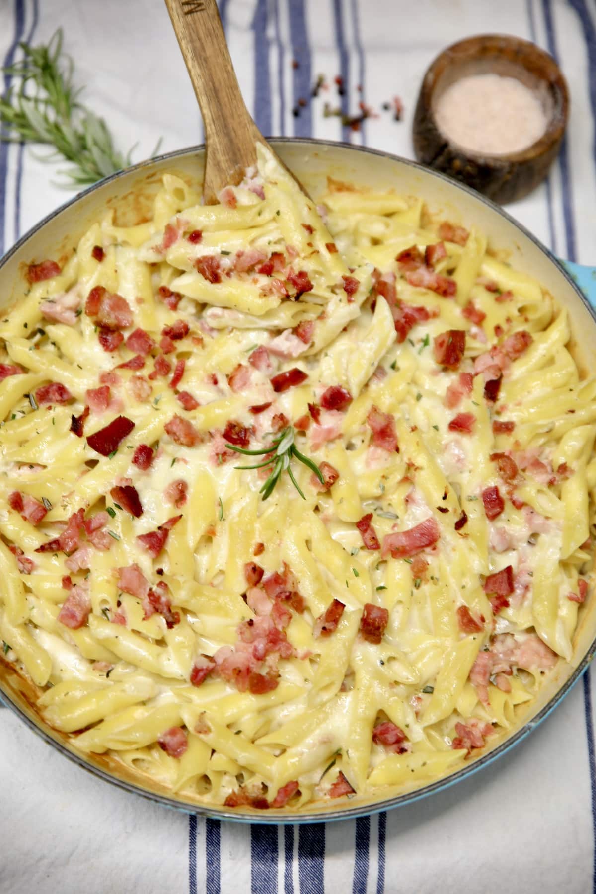 Overhead of round casserole with pasta and ham.