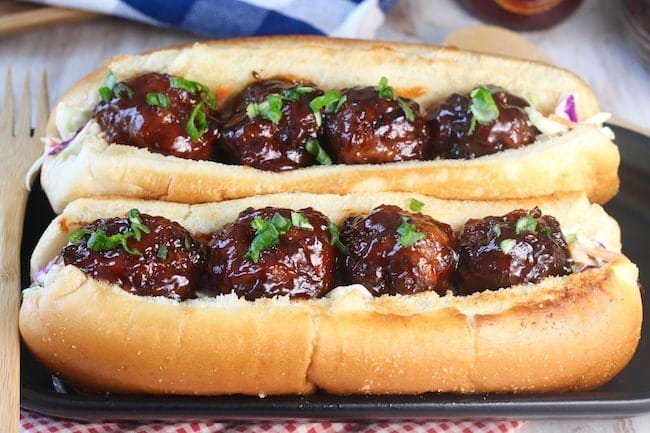 Barbecue Meatball Hoagie Sandwiches on a black platter