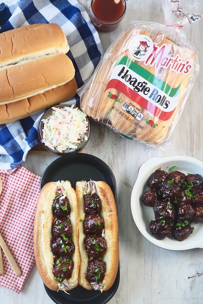 Barbecue Meatball Hoagies with Martin's Hoagie Rolls, bowl of coleslaw and barbecue meatballs in a shallow dish